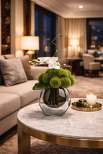 Laden Sie das Bild in den Galerie-Viewer, VICKY YAO Design Aesthetic - Artificial Green Moss Ball Floral Arrangement with Orchid, Modern Faux Flower Decor in Glass Vase L18 x H26cm